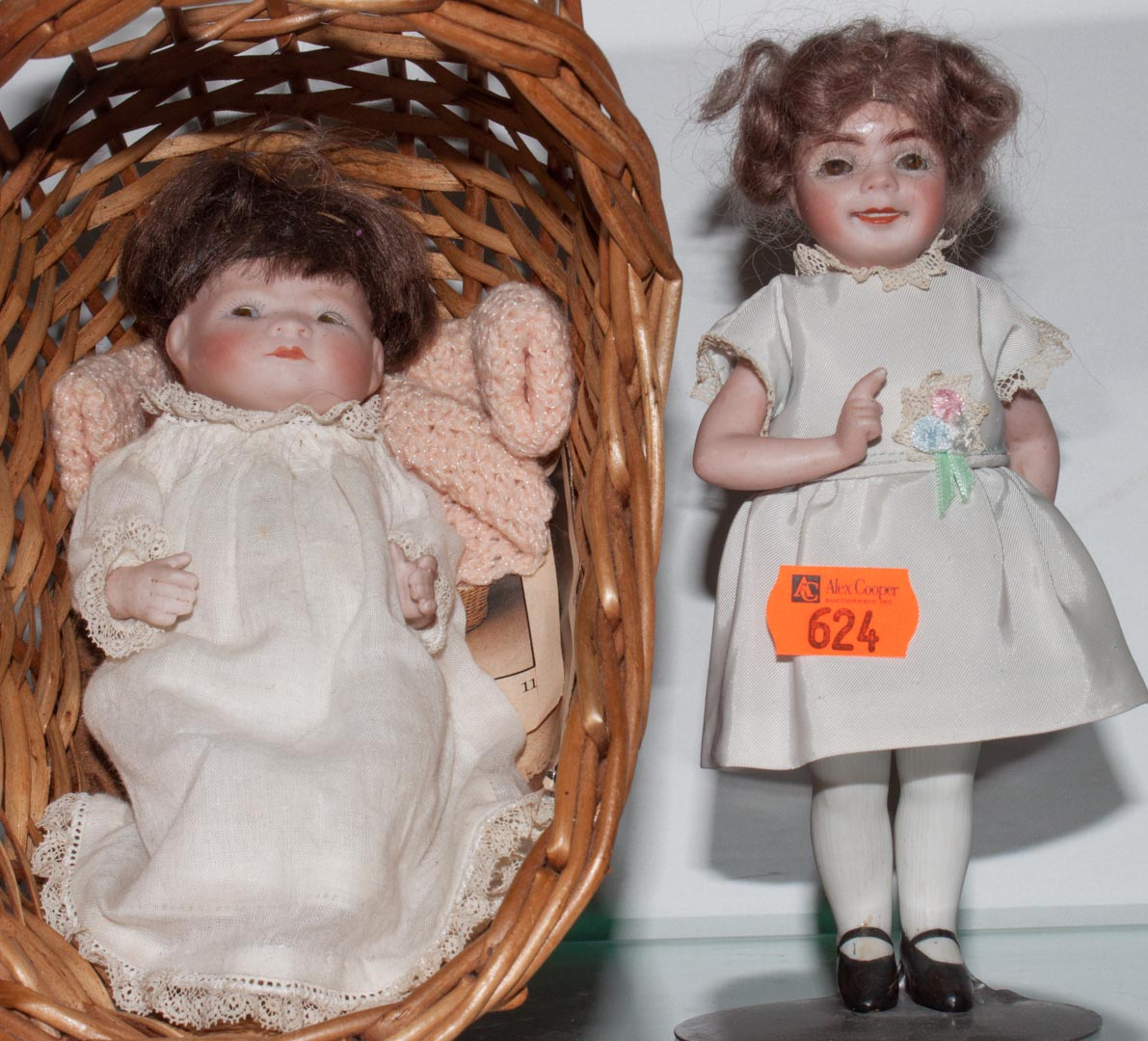 Two miniature painted bisque dolls first quarter 20th century includes