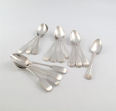 A small collection of fifteen silver dessert spoons various dates