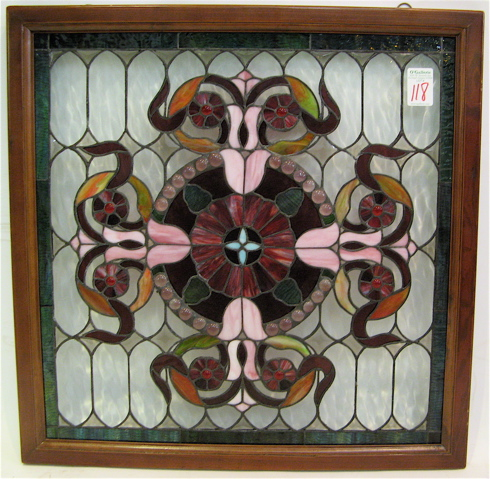 A STAINED AND LEADED GLASS WINDOW PANEL in the manner