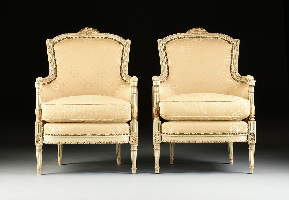 A PAIR OF LOUIS XVI STYLE SILK UPHOLSTERED PARCEL GILT