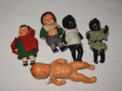 A pair of all bisque dolls house dolls with painted