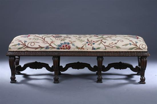 CONTINENTAL RENAISSANCE REVIVAL CARVED WALNUT BANQUETTE 19th century with crewel