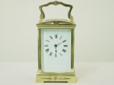 4 French carriage clock time only shaped handle and domed