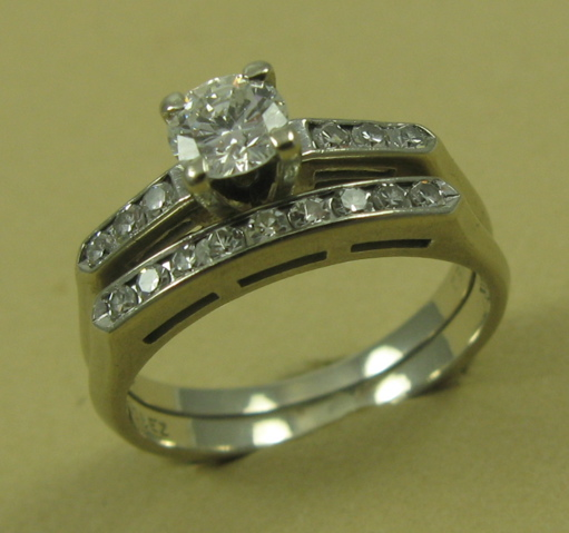 DIAMOND AND FOURTEEN KARAT GOLD WEDDING SET with appraisal The
