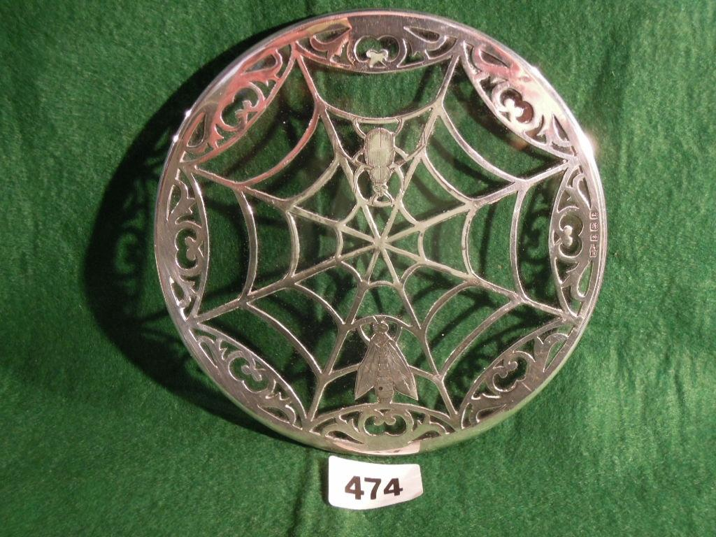 A silver and glass wine coaster in the form of