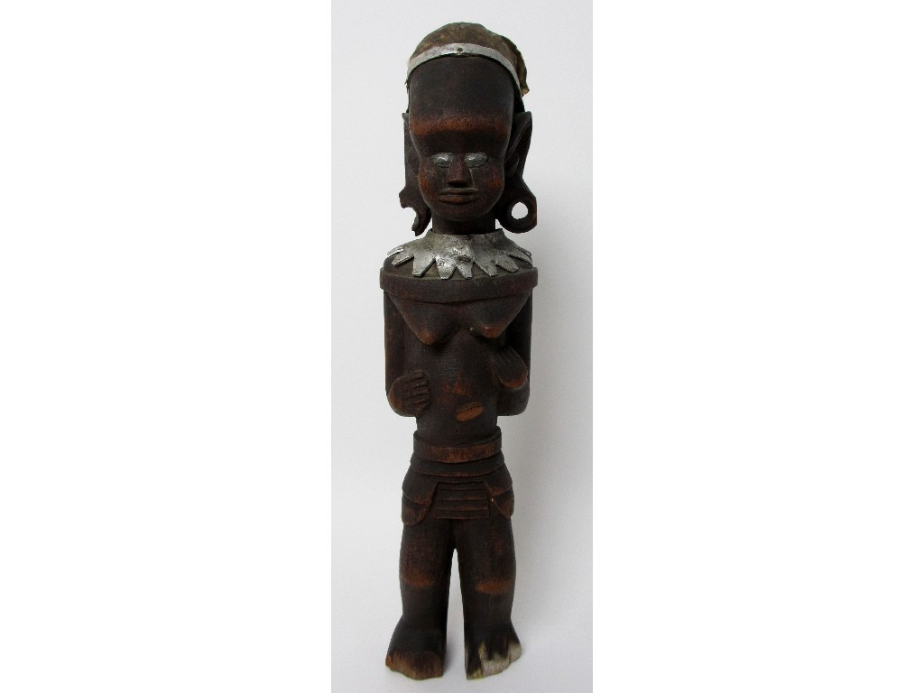 A North Yoruba votive carved wood female figure with parchment