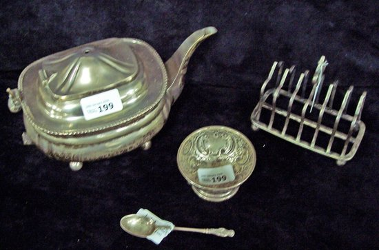 A teapot an embossed silver bowl a toast rack and