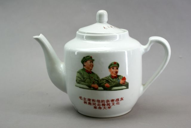 A Chinese porcelain teapot and cover decorated with transferred images