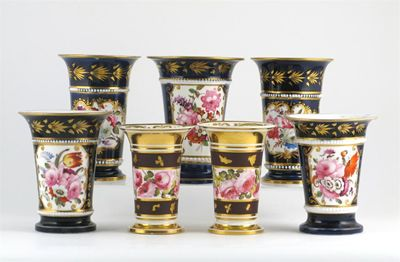 A garniture of three porcelain spill vases painted with floral
