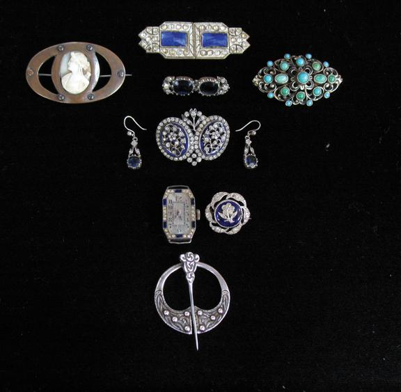 AN EDWARDIAN BLUE ENAMEL AND CLEAR PASTE BROOCH the two