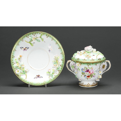 A Staffordshire floral encrusted two handed cup cover and stand