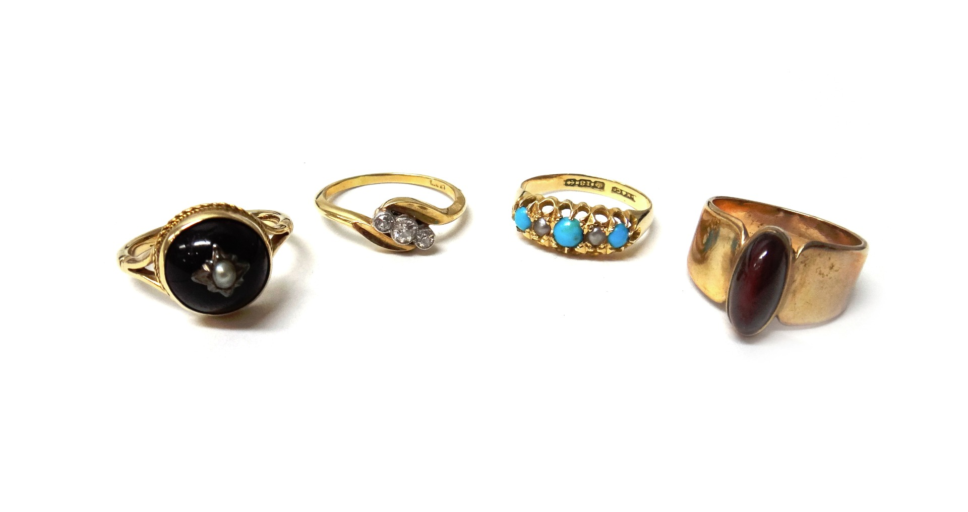 A gold and diamond set three stone ring mounted with