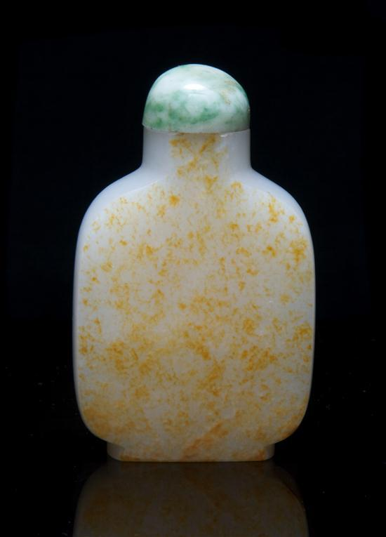 White Jade Snuff Bottle of baluster form with one side
