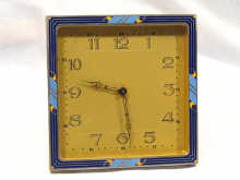 An Art Deco square strut clock with enamelled front circa