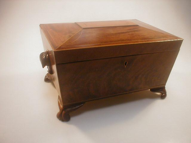 An early 19thC mahogany sarcophagus work box the hinged top