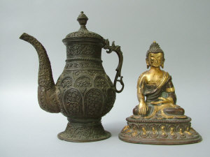 A 17th century Sino Tibetan gilt bronze figure of the