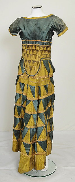 A silk Cretan style dress costume in green tones designed