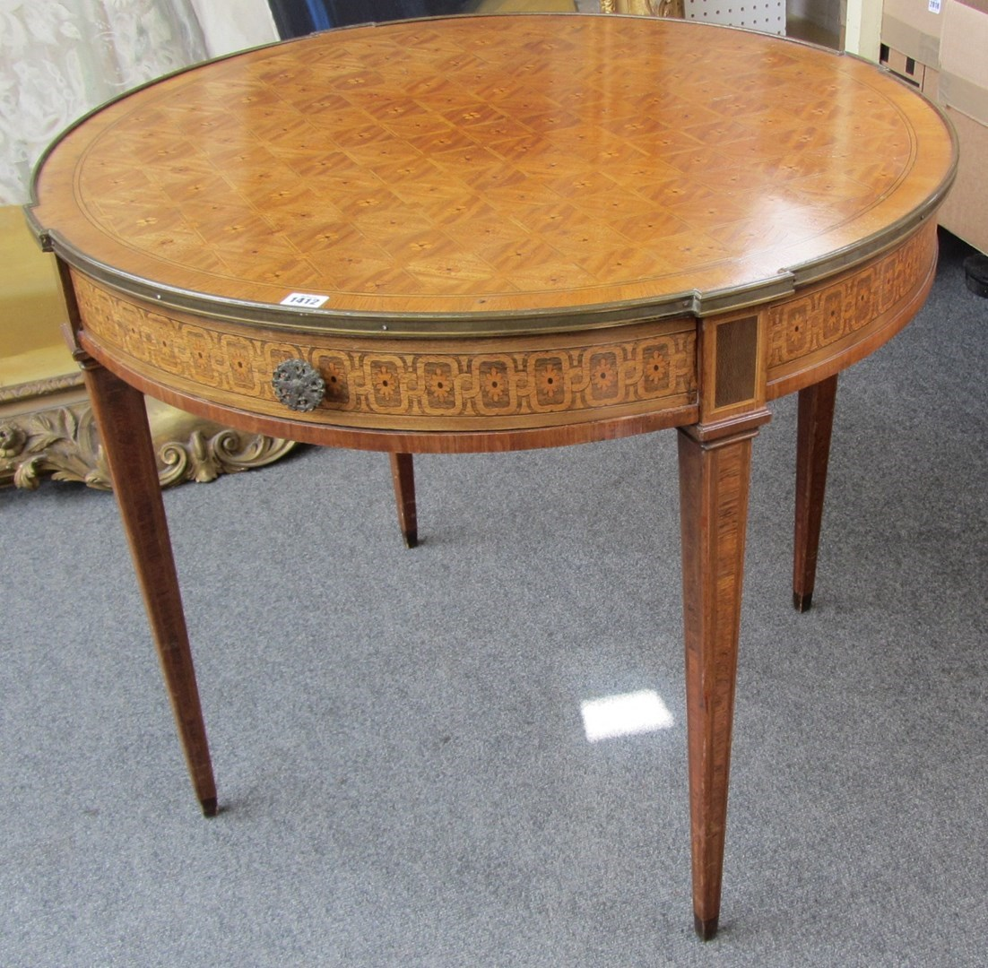 A late 19th century French parquetry inlaid mahogany gilt metal