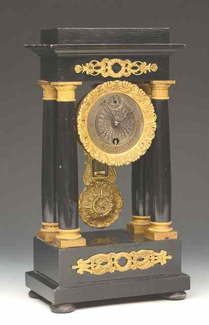 A 19TH CENTURY FRENCH EBONISED AND ORMOLU MOUNTED PORTICO TIMEPIECE