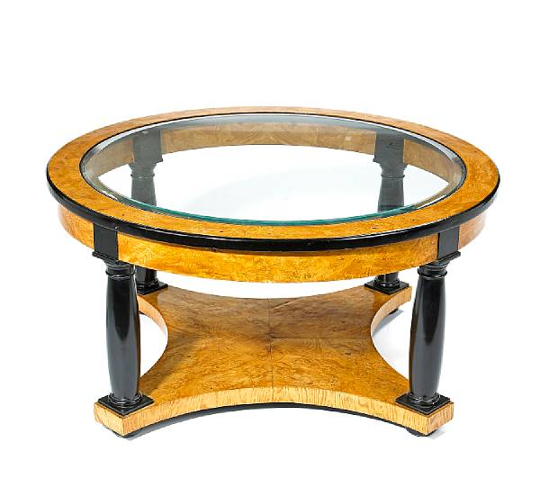 A Biedermeier style figured elmwood and parcel ebonized low table
