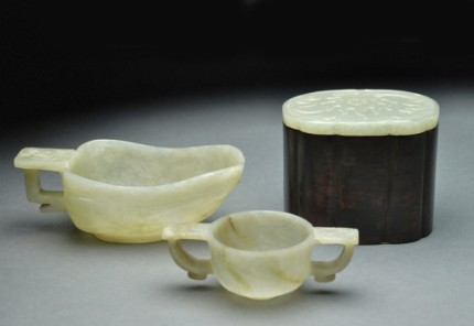 Scoop shape cup with single handle carved of celadon stone
