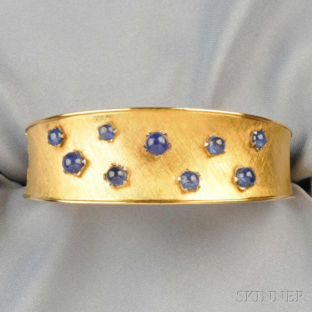 18kt Gold and Sapphire Bracelet designed as a hinged cuff