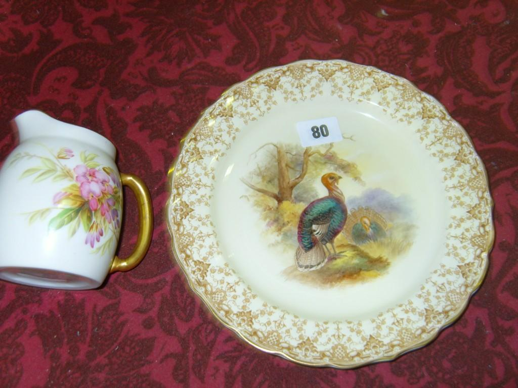 An ivory ground 19th century Royal Worcester jug with painted