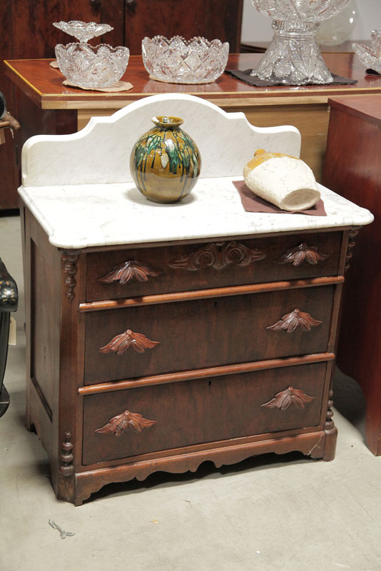VICTORIAN COMMODE White marble top having a shaped gallery on