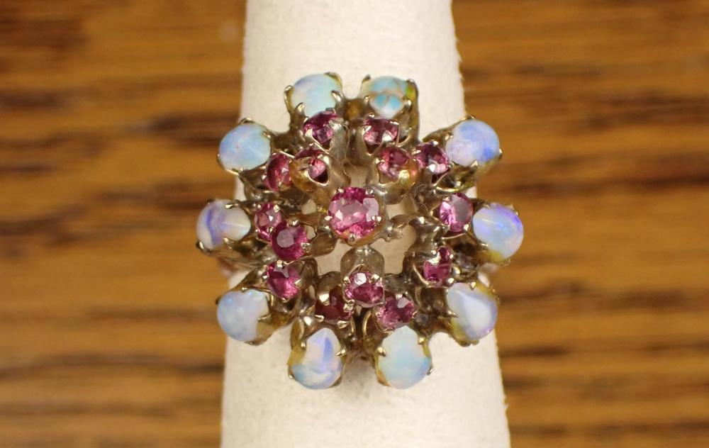 OPAL RUBY AND FOURTEEN KARAT GOLD RING The 14k yellow