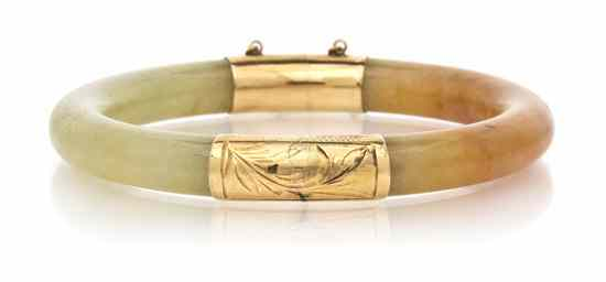 A 14 Karat Yellow Gold and Jade Bangle Bracelet consisting