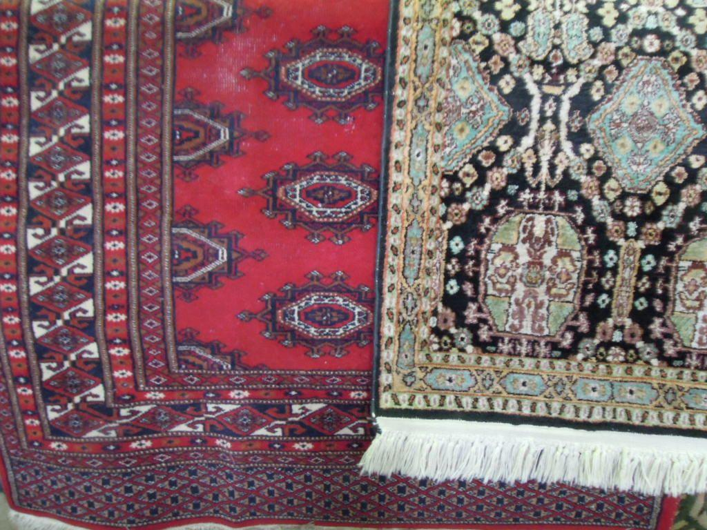A Bokhara style carpet with a central panel interspersed with