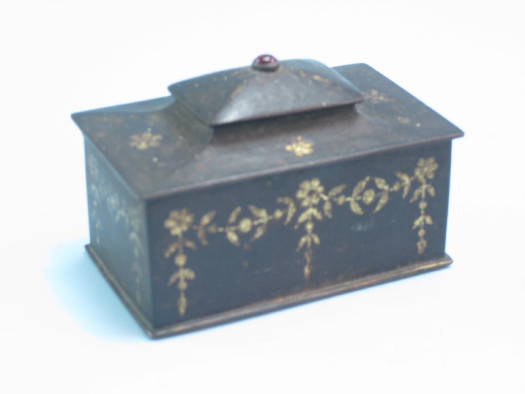 A 19th Century small iron Casket of sarcophagus shape with