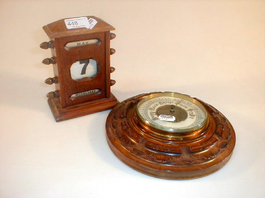 An Edwardian desk calendar and walnut aneroid barometer 2 30