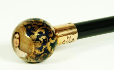 AN EARLY VICTORIAN EBONISED WALKING CANE the Continental porcelain pommel
