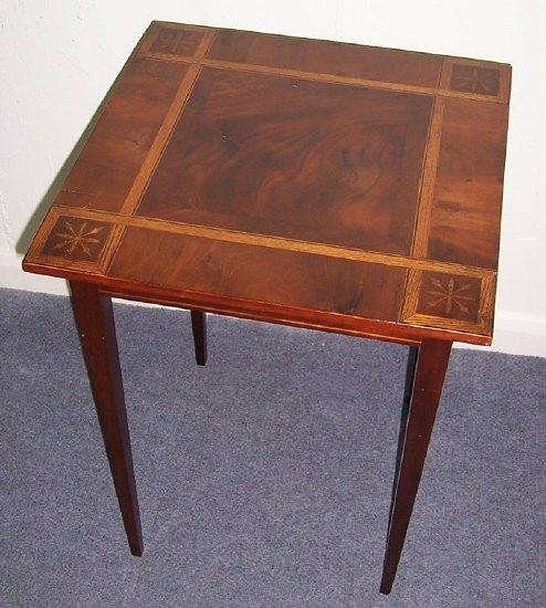 A mahogany and inlaid table the square top with geometric