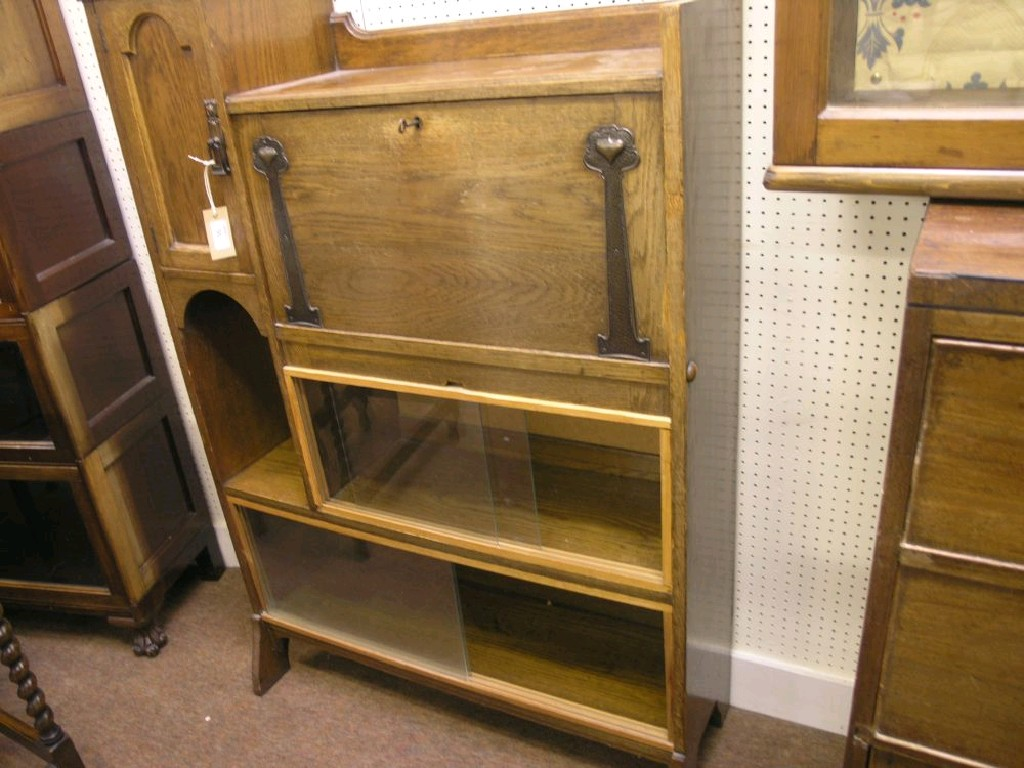 An Art Nouveau solid oak student s bureau fall front