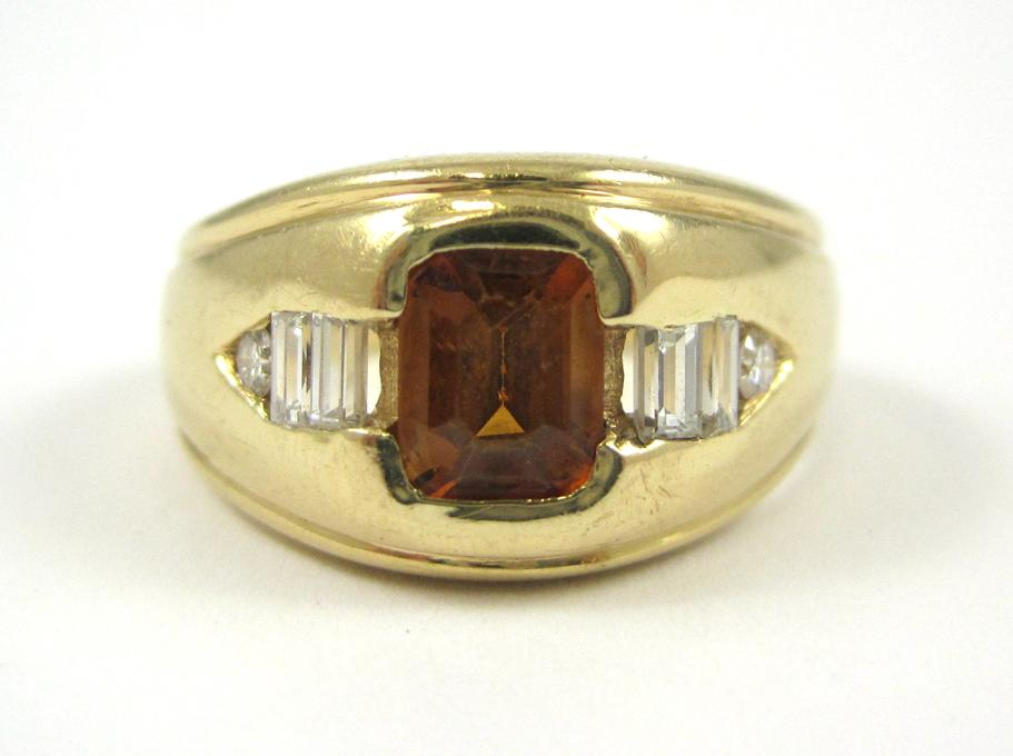 MALAYA GARNET DIAMOND AND FOURTEEN KARAT GOLD RING with one