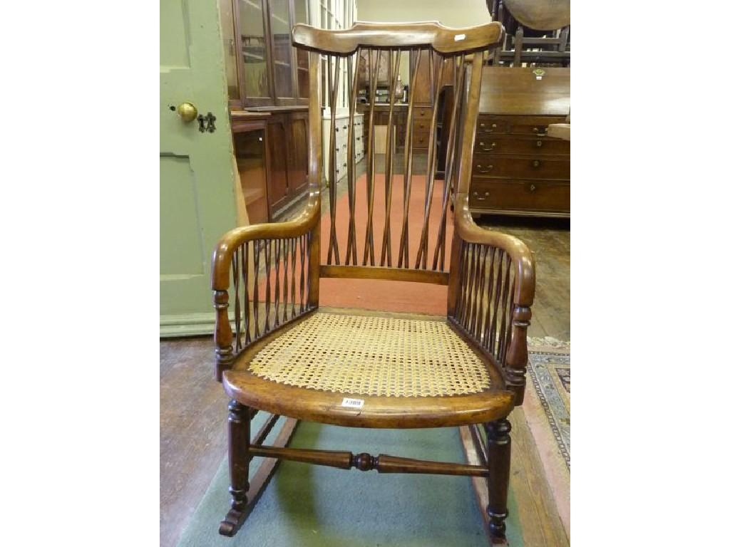 A Victorian rocking chair with entwined stick panels surrounding a