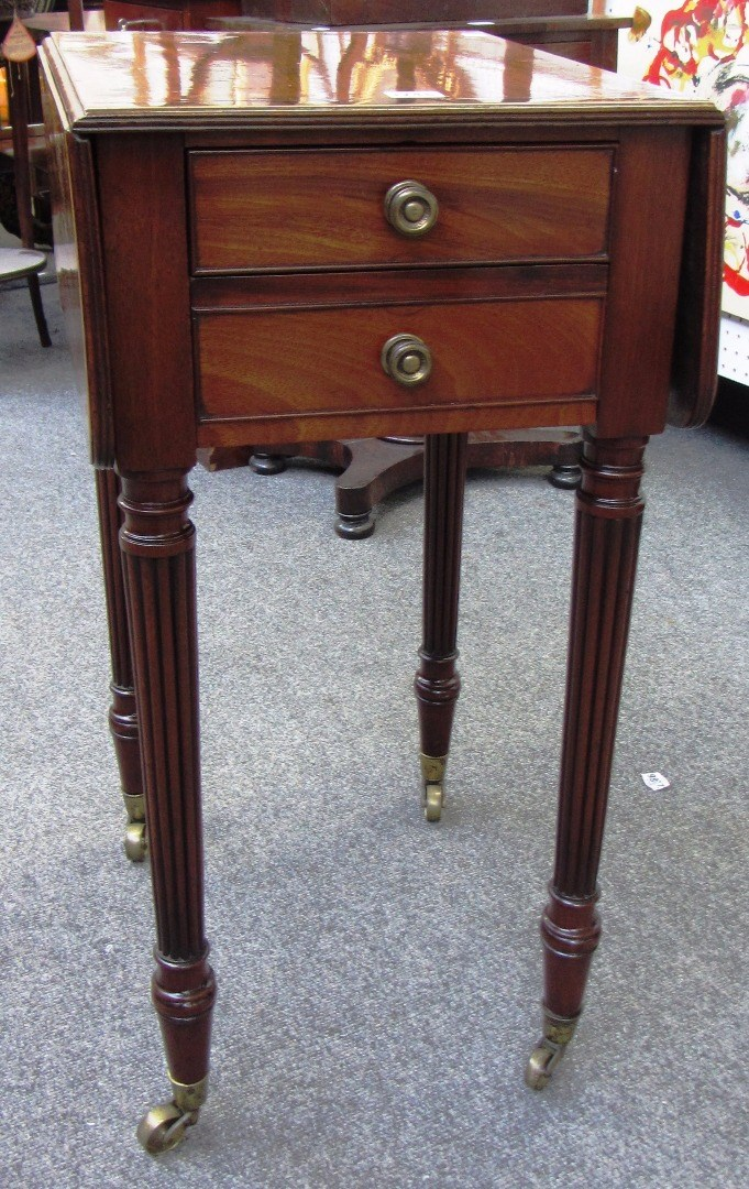 An early 19th century rosewood banded mahogany drop flap work