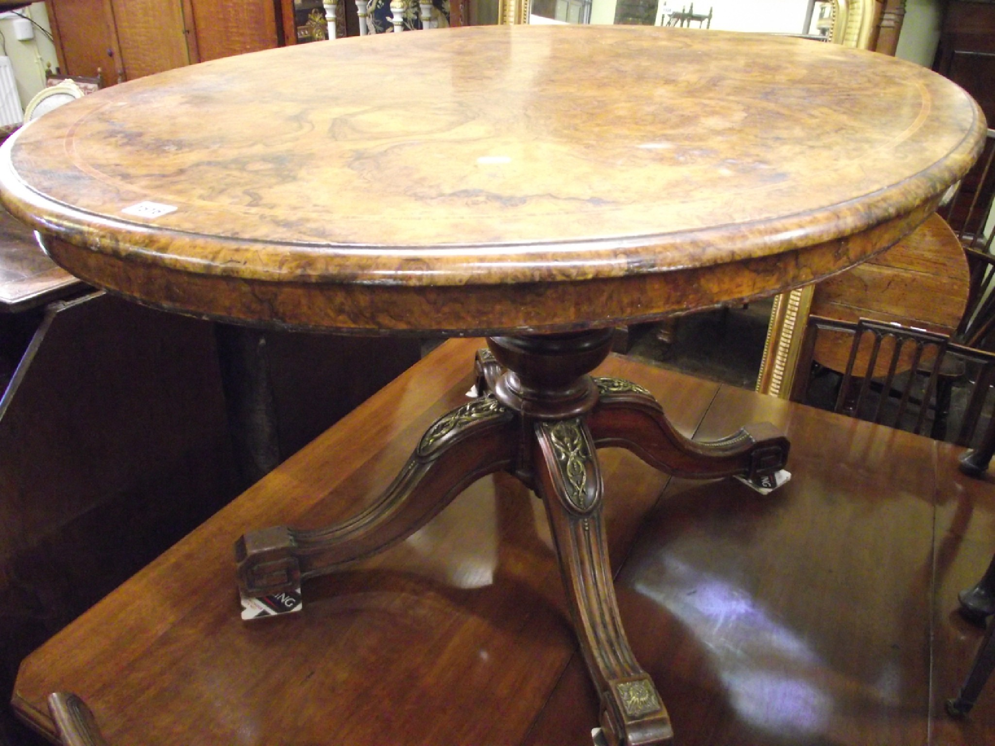 A Victorian walnut and burr walnut loo table the oval