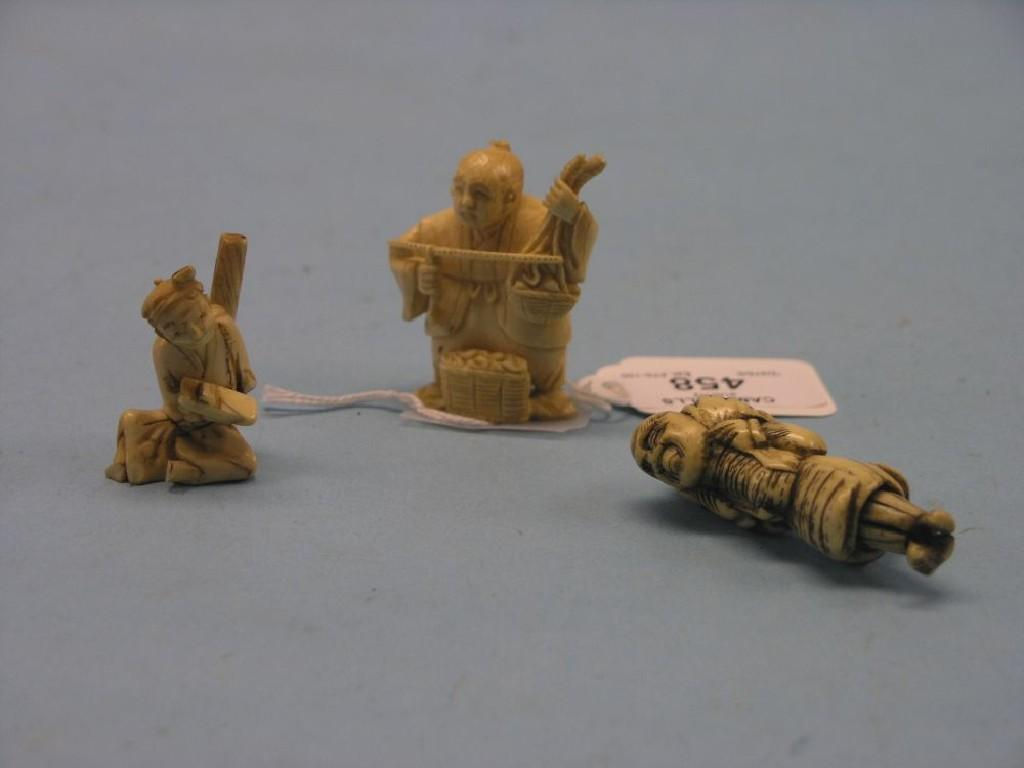 Two Japanese carved ivory figural netsuke male labourers one signed