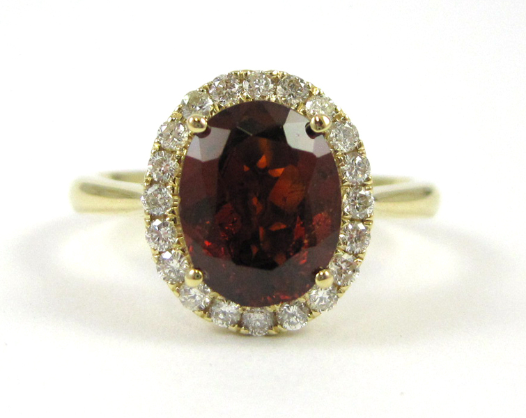 GARNET DIAMOND AND FOURTEEN KARAT GOLD RING with round cut