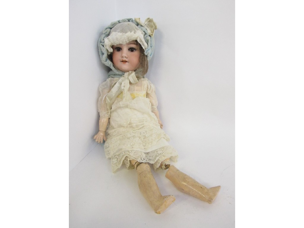 Bisque headed doll with composition body lower left leg detached