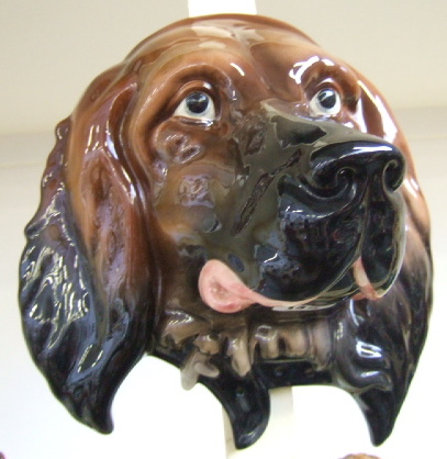 A Beswick wall mask modelled as a brown gloss retriever