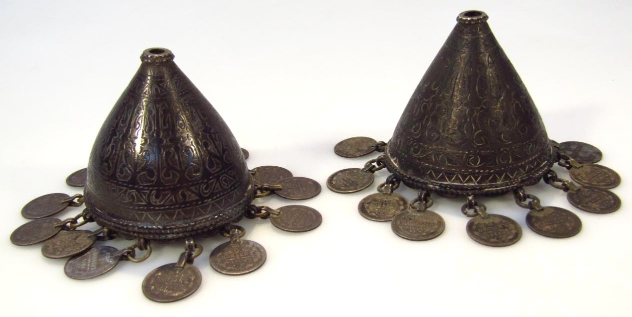 A pair of Eastern European hand bells each of domed
