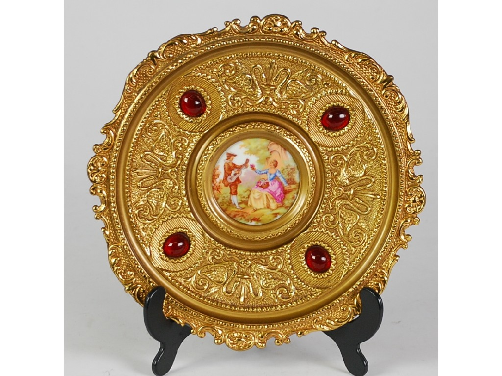 CONTINENTAL GILT METAL WALL PLAQUE with porcelain centre printed after