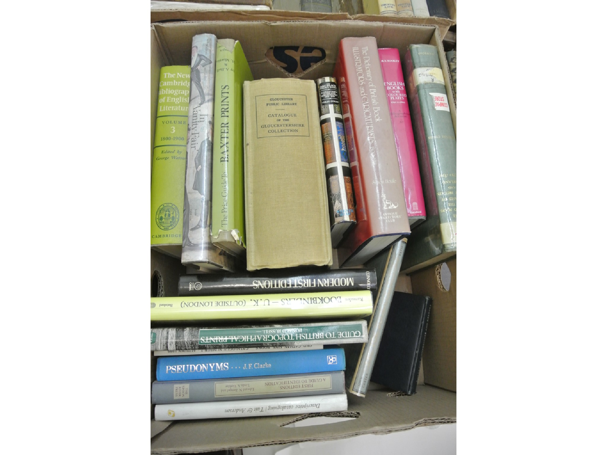 A box of books relating to Vanity Fair prints a