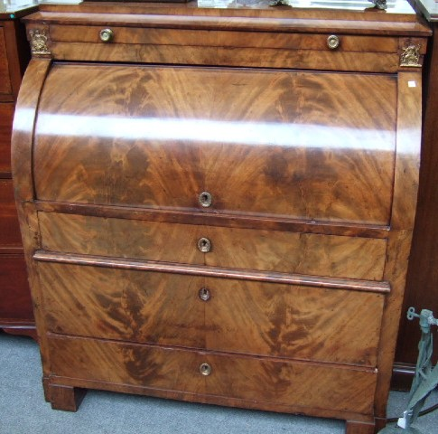 A mid 19th century mahogany gilt mounted cylinder bureau the