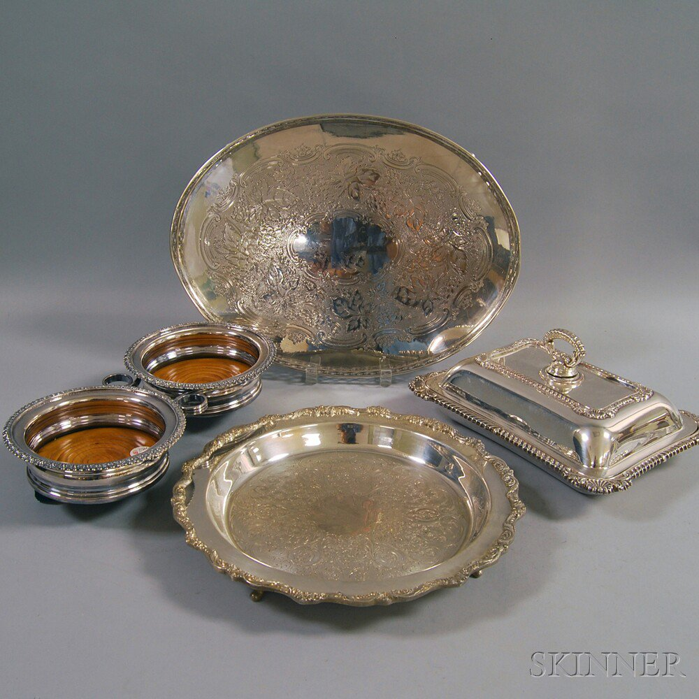 Four Silver plated Serving Items a covered vegetable dish a