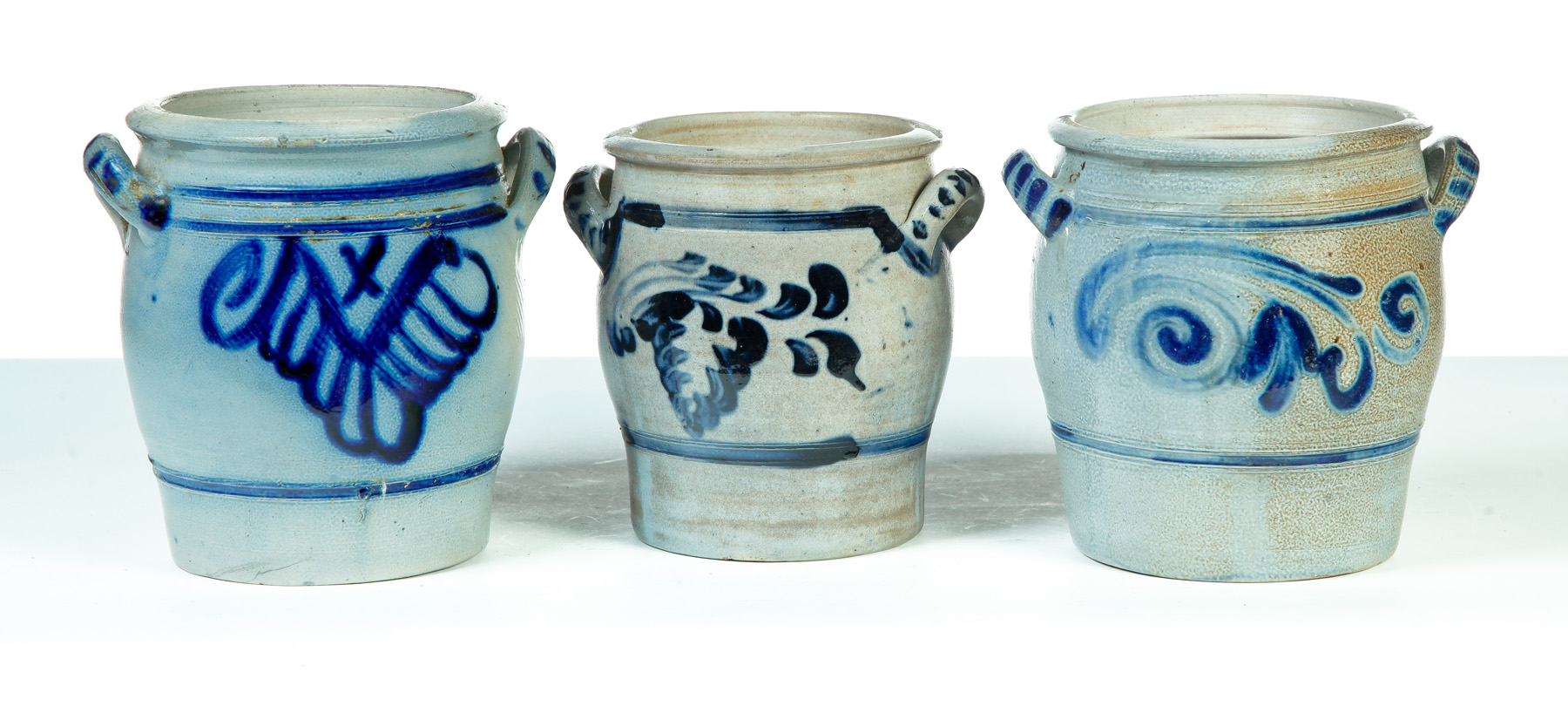 THREE GERMAN GRADUATED DOUBLE HANDLED STONEWARE JARS Nineteenth century Salt